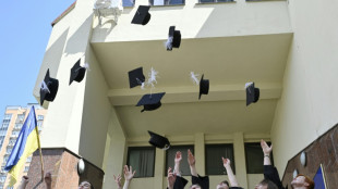 War, uncertainty push proud Ukraine graduates to 'live now'