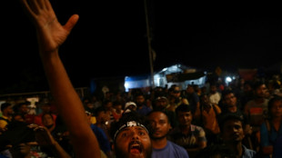 Sri Lankans await formal resignation after president flees