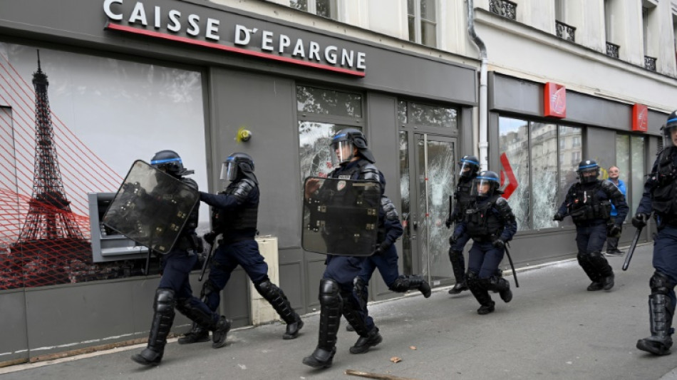 Tensions erupt at Paris protest as police car attacked