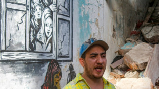 Yemen street artist chronicles war on battle-scarred walls