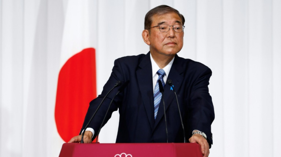 Bruised Japan PM scrambles for support