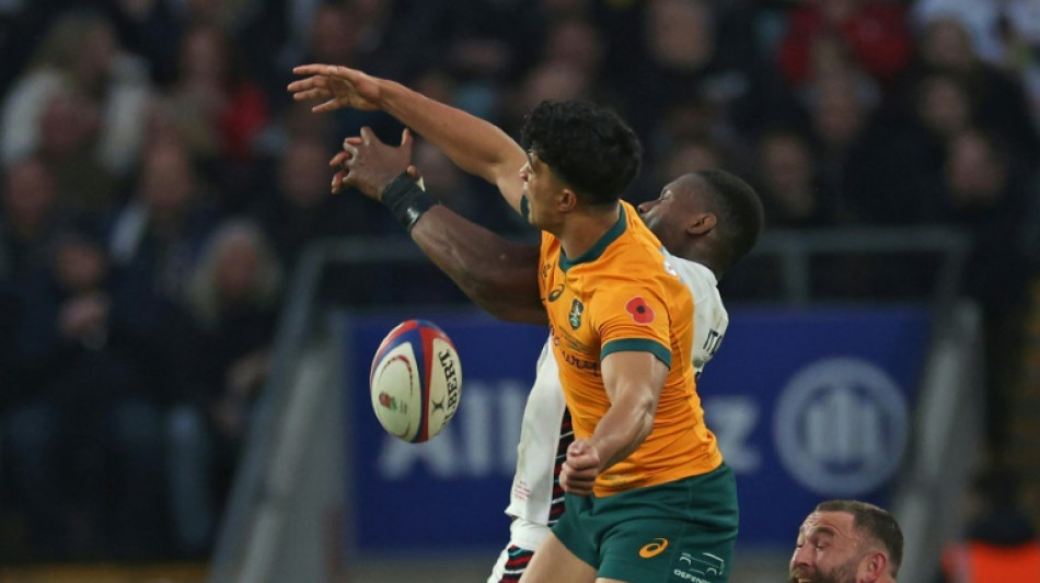 Schmidt elated by 'aerial freak' Suaalii as Australia edge England