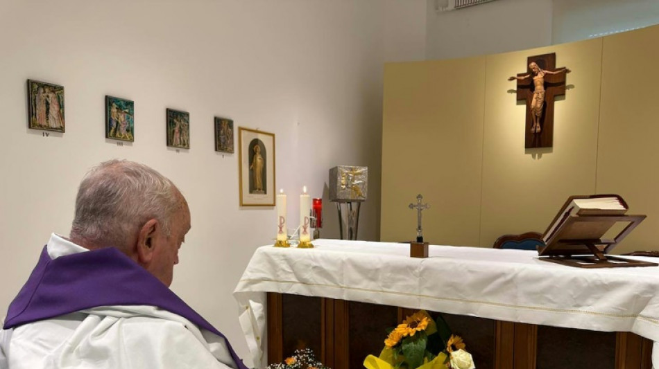 Pope seen celebrating mass in first photo since hospitalisation