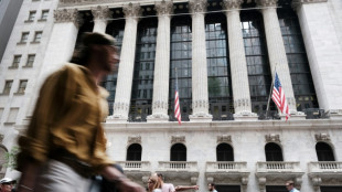 Wall Street finit dans le vert après la modeste hausse des taux de la Fed