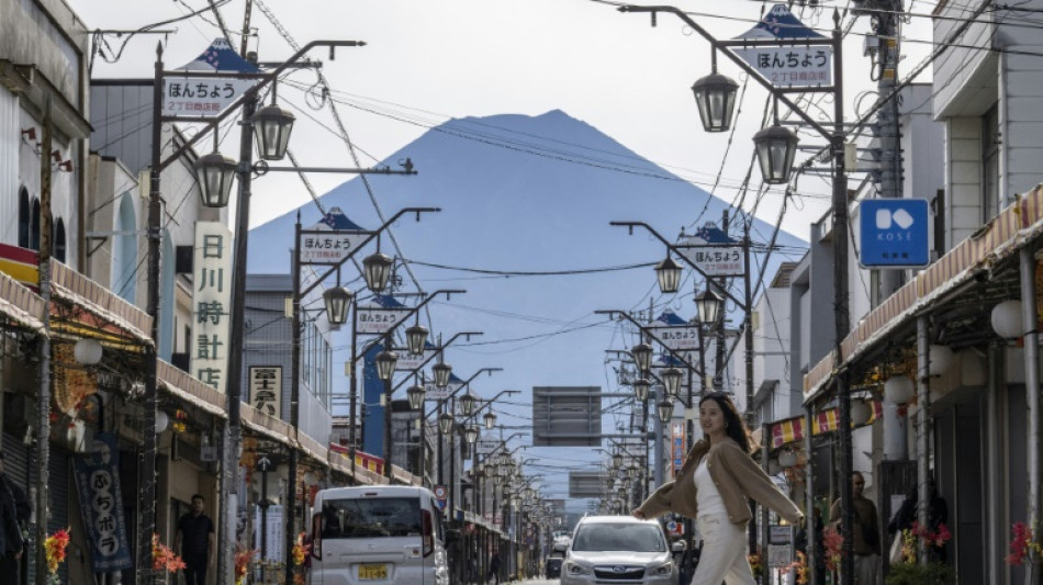 Snow seen on Mount Fuji after record time without