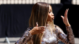 Rapper Cardi B, the target of a thrown liquid, retaliates