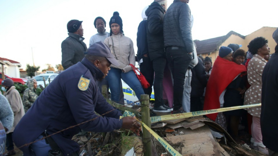 S.African police search bar for clues after 21 teens die