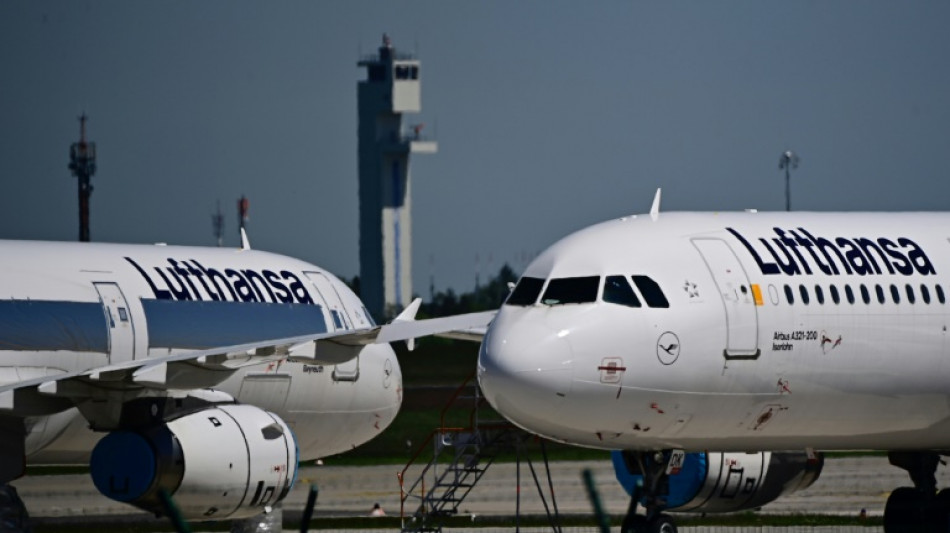 Lufthansa reports loss, cuts outlook after strikes