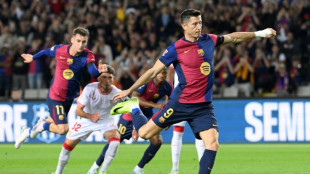 Lethal Lewandowski helps Barca rout Sevilla, Atletico triumph