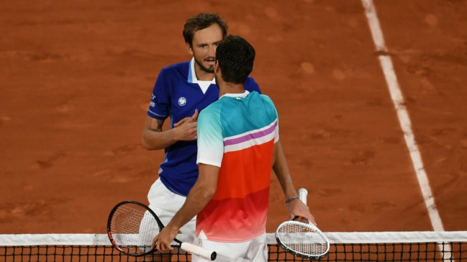 Medvedev and Tsitsipas crash at French Open as Swiatek survives scare