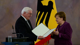 Merkel given Germany's top honour despite criticism