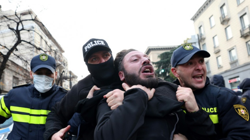  Police break up Georgia vote protest as president mounts court challenge 