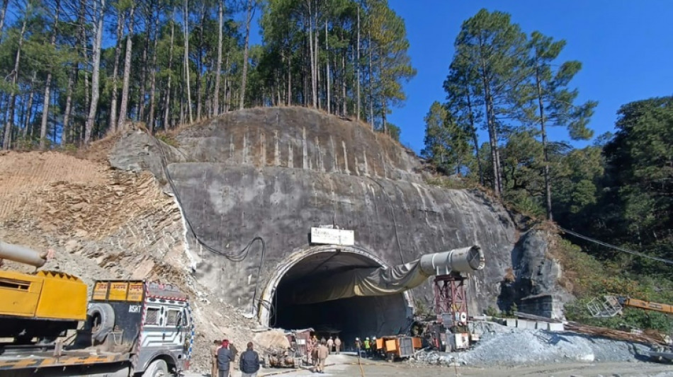 Indian rescuers battle to save 40 workers trapped in collapsed tunnel