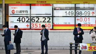 Stock markets waver after Tokyo record