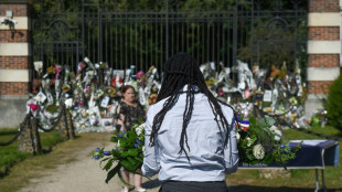 Fans mourn as film legend Delon is buried near his dogs