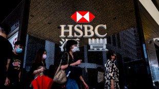 HSBC H1 pre-tax profit falls, says to pay quarterly dividends