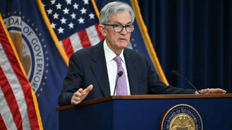 US Fed cuts key rate a quarter point, signals fewer cuts ahead