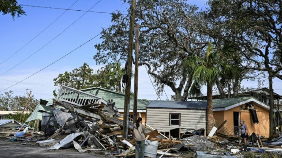  With 118 dead from Hurricane Helene, Biden defends US government response 